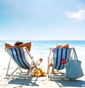 honeymoon_couple_relaxing_on_beach-1.jpg