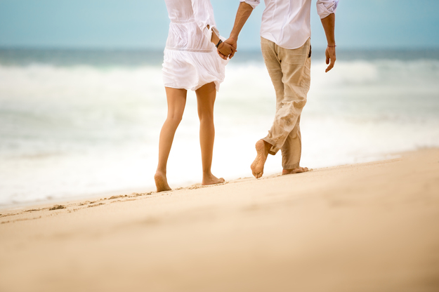 honeymoon_couple_holding_hands_beach.jpg