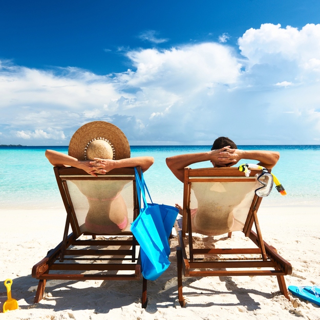 honeymoon_couple_lounging_beach-1.jpg